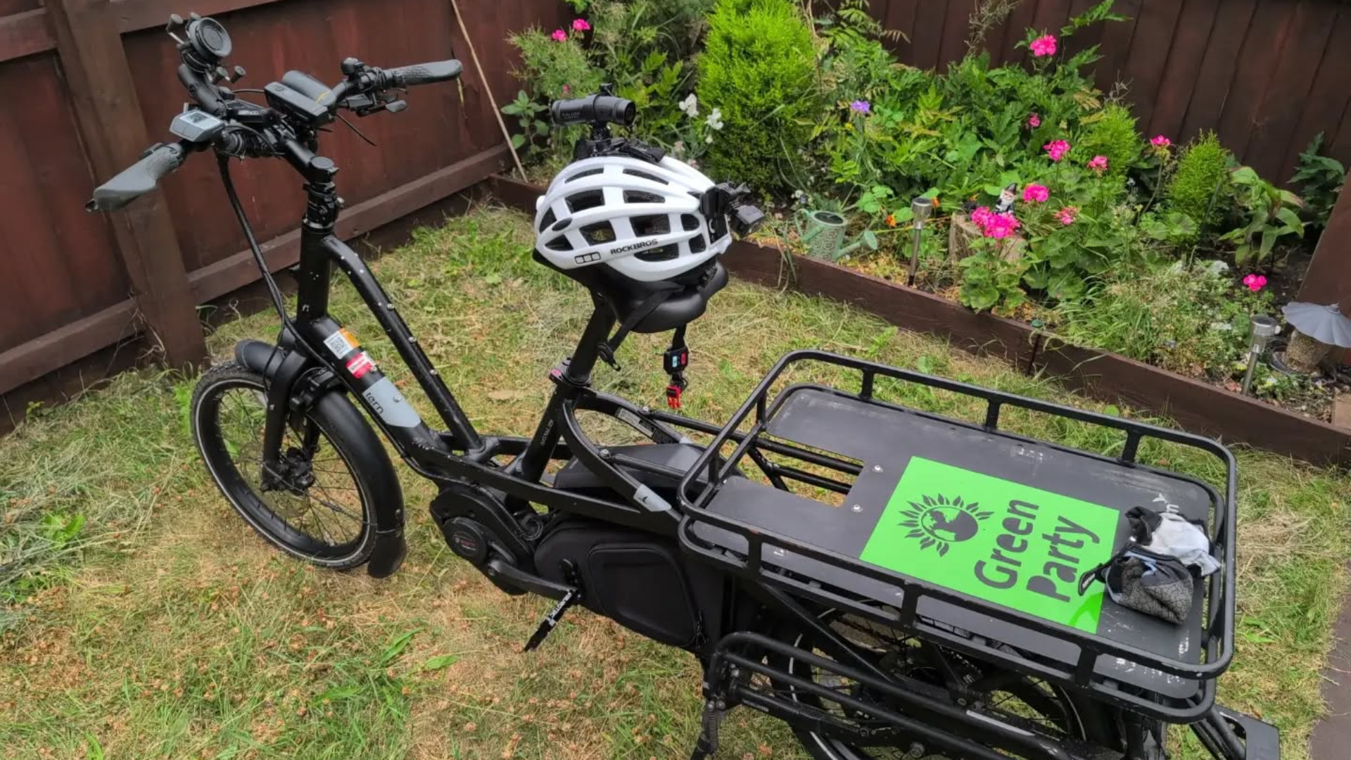 A picture of my Tern Quick Haul Long D9 electric cargo bike, the bike I will be using for the cycle challenge. It has a 'Green Party' sticker on the back.