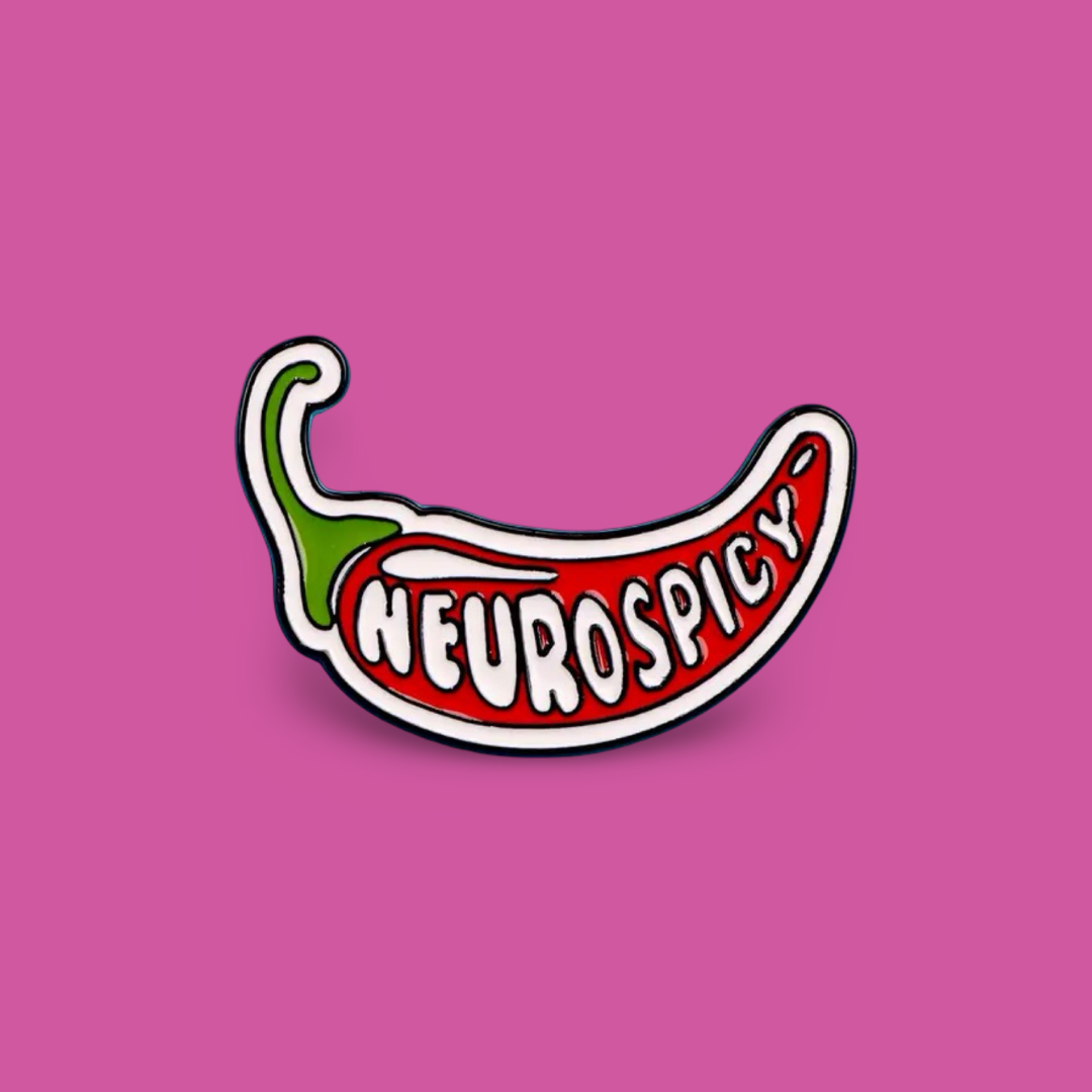 Picture of a 'neurospicy' pin badge against a pink background.