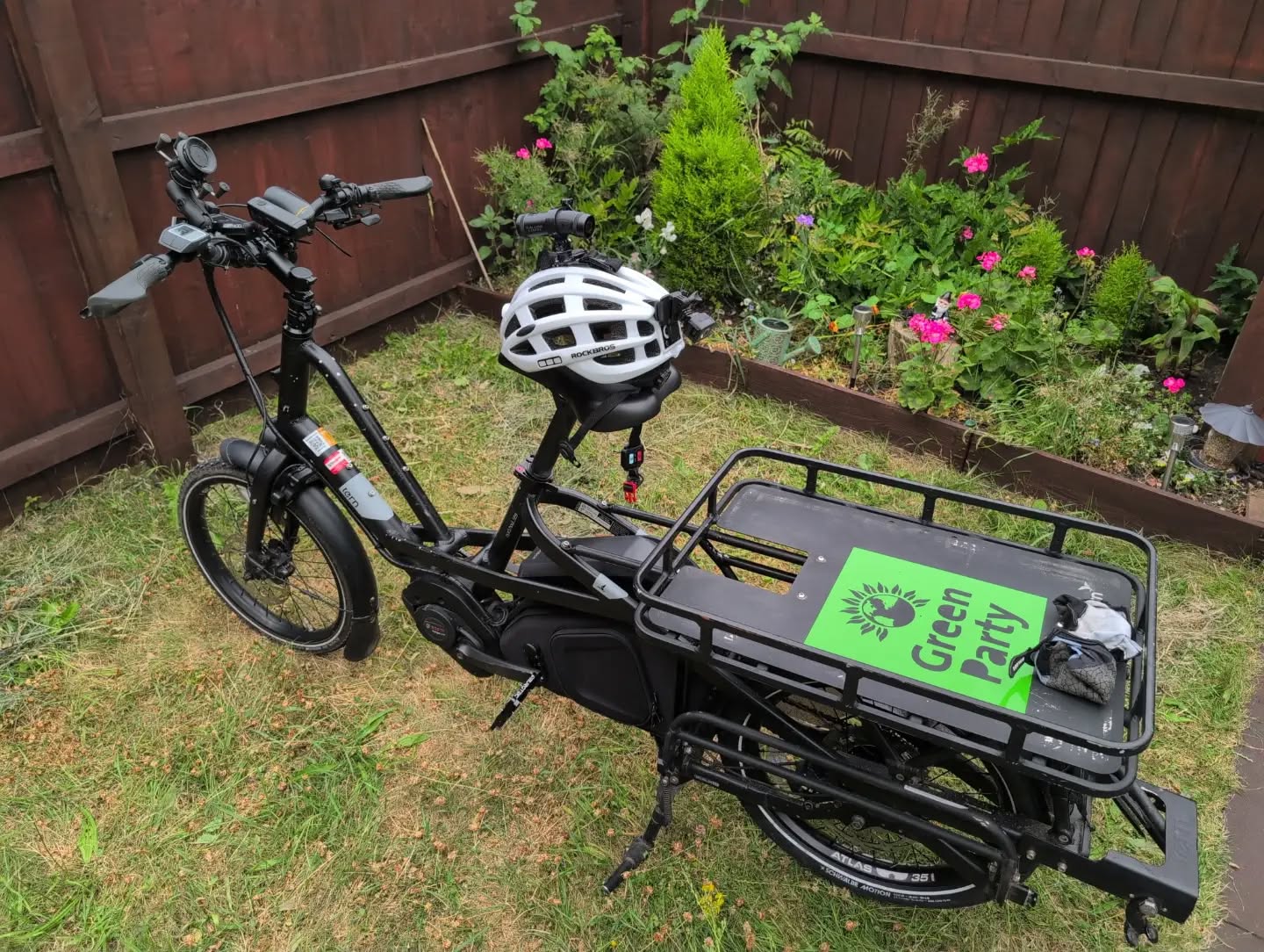 Picture of my electric cargo bike with a 'Green Party' sticker on the back.